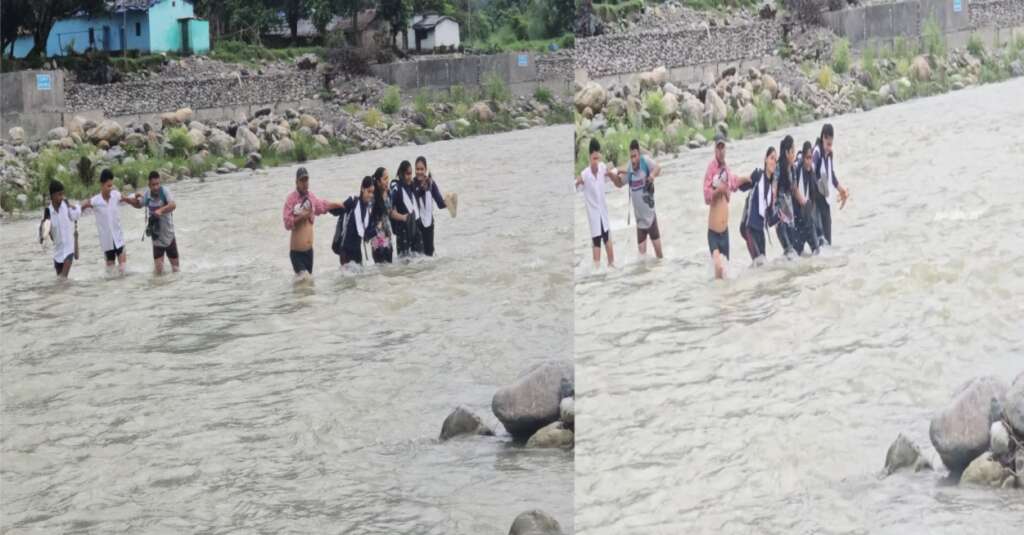 School students crossing the swollen